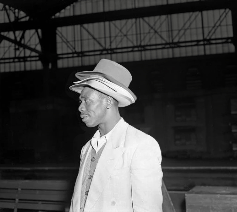 Man wearing two hats