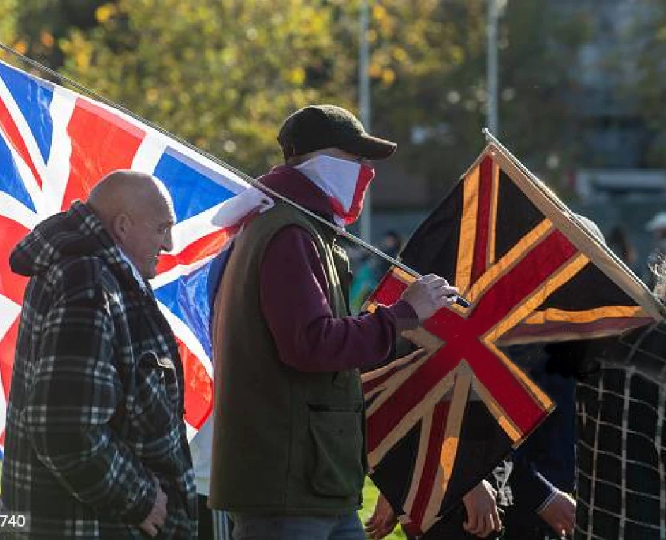 Rioters with Union Jack flags